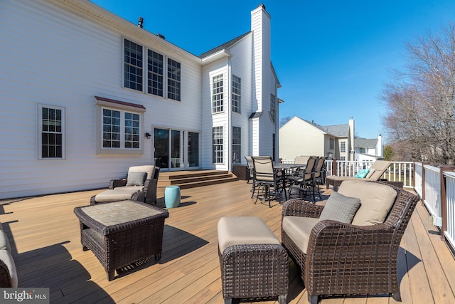 wooden deck with outdoor dining space