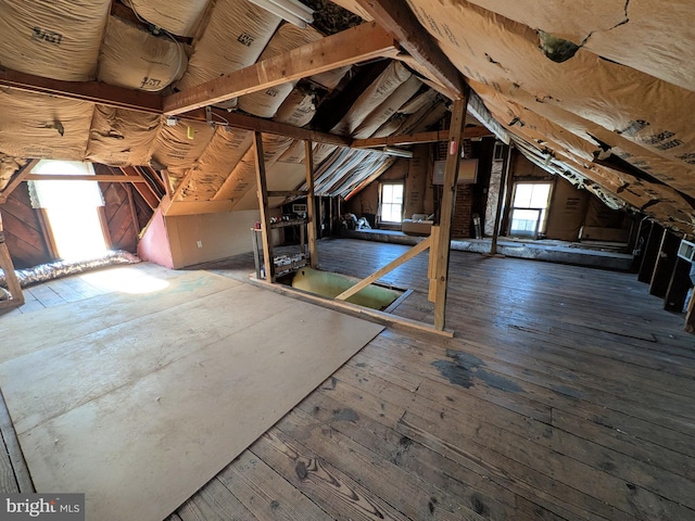 unfinished attic with an upstairs landing