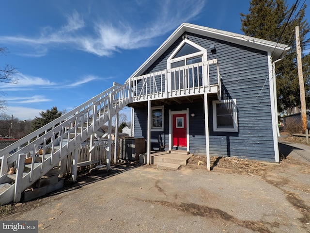 view of front of property with stairs