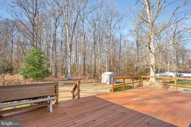 wooden terrace with a shed