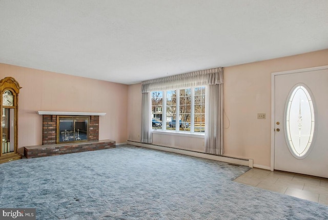 unfurnished living room with light carpet, a fireplace, and baseboard heating