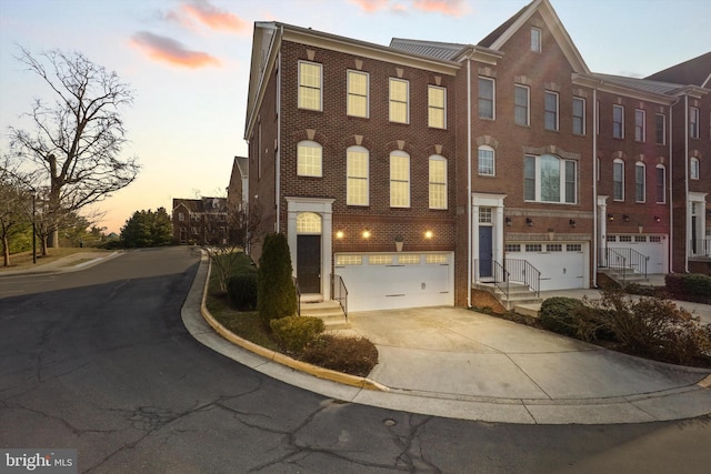 townhome / multi-family property featuring a garage