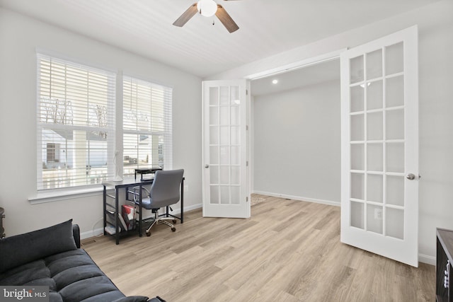 office area featuring ceiling fan, baseboards, wood finished floors, and french doors