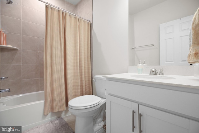 bathroom with vanity, toilet, and shower / bathtub combination with curtain