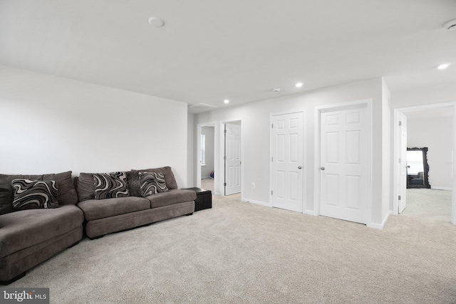 living room with carpet floors, baseboards, and recessed lighting