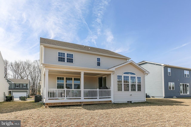 view of front of house with covered porch and central AC unit