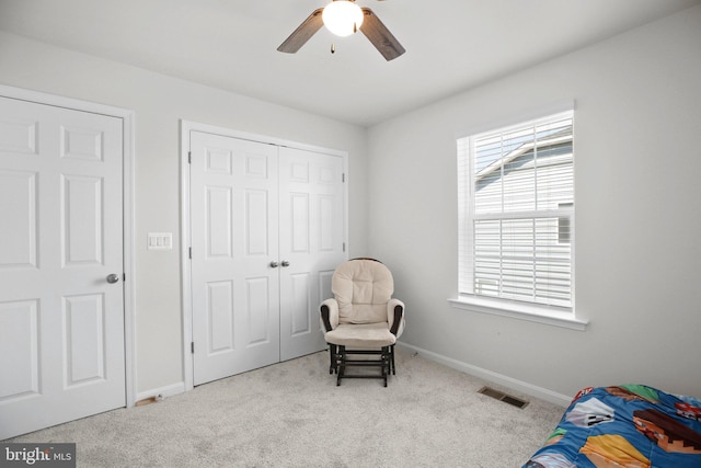 bedroom featuring carpet floors, a closet, visible vents, and baseboards