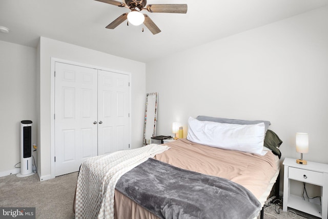 bedroom featuring baseboards, carpet, a ceiling fan, and a closet