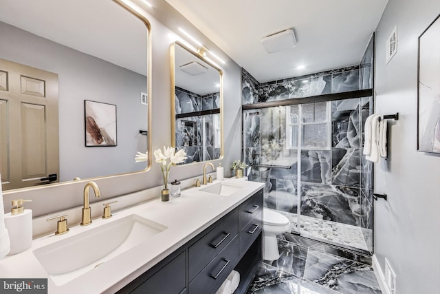 bathroom featuring an enclosed shower, vanity, and toilet