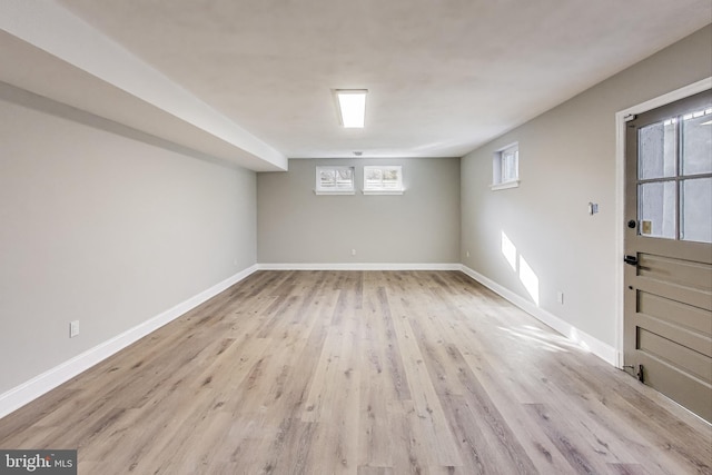 basement featuring light hardwood / wood-style floors