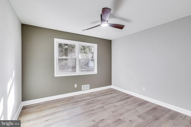 unfurnished room featuring ceiling fan and light hardwood / wood-style flooring