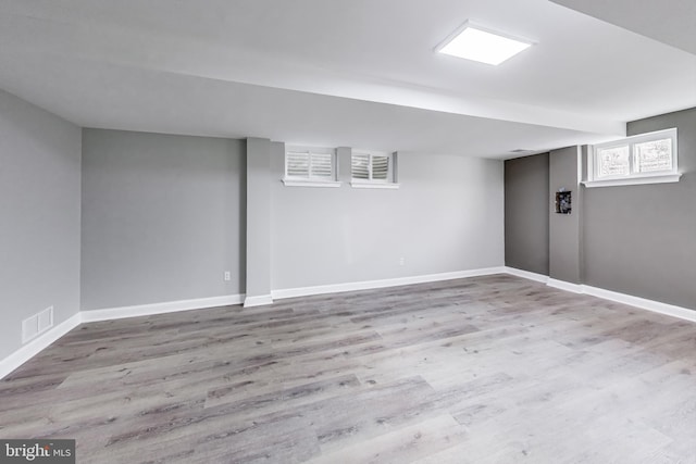 basement featuring light hardwood / wood-style floors