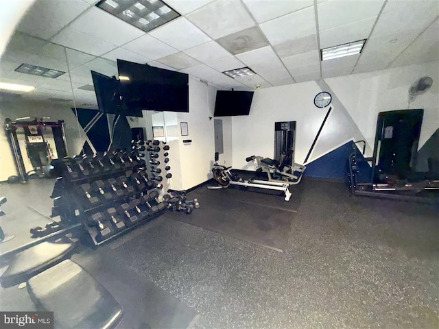 exercise room featuring a drop ceiling