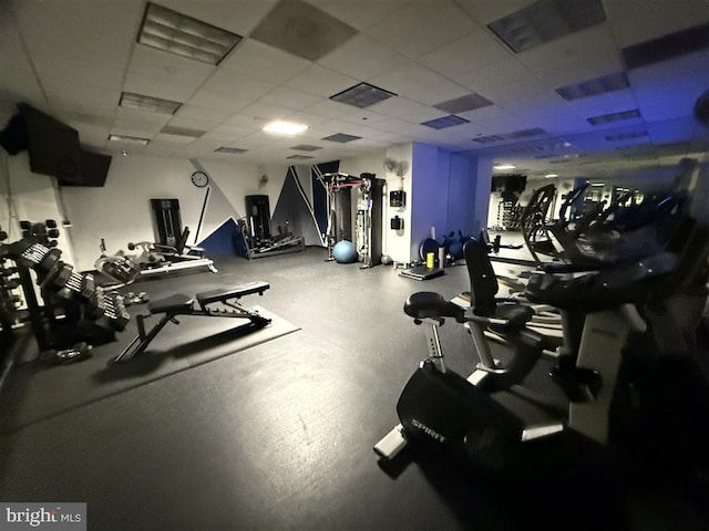 gym with visible vents and a paneled ceiling