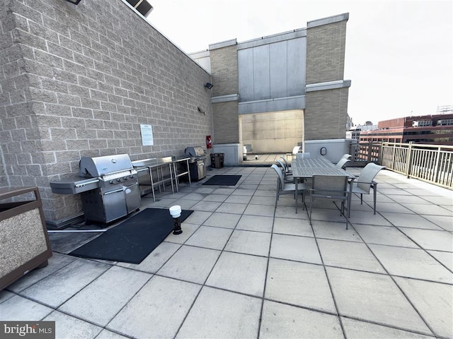 view of patio featuring outdoor dining space and grilling area