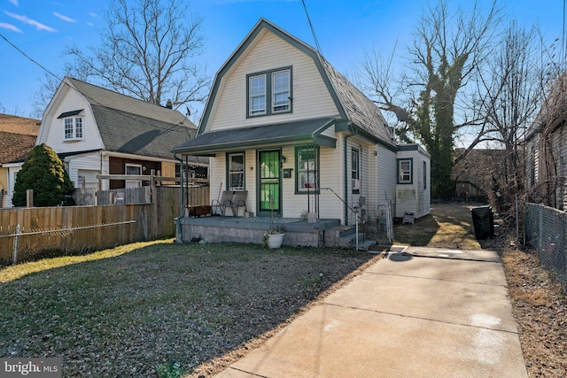 bungalow-style home with a porch and a front lawn