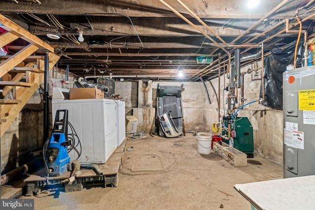 basement featuring water heater and washer and dryer