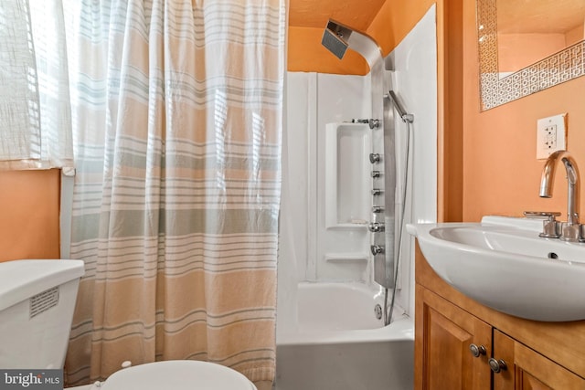 full bathroom featuring vanity, toilet, and shower / bath combo with shower curtain