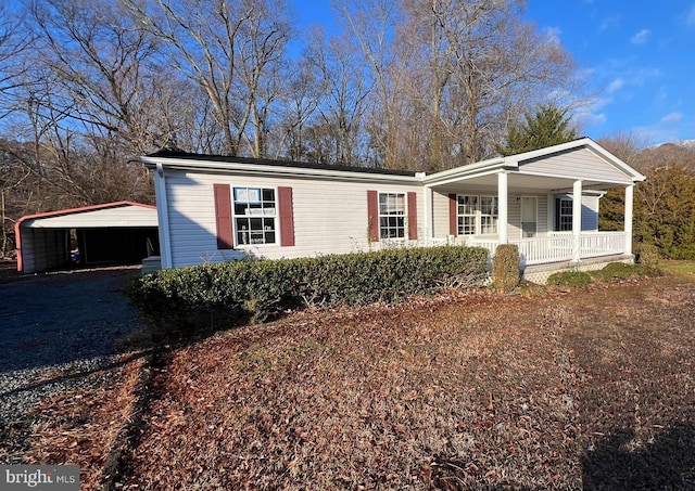 view of front facade with a carport and a porch