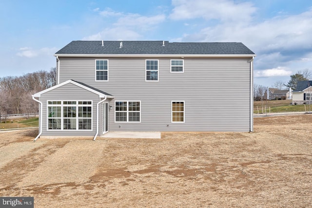 back of house with a patio