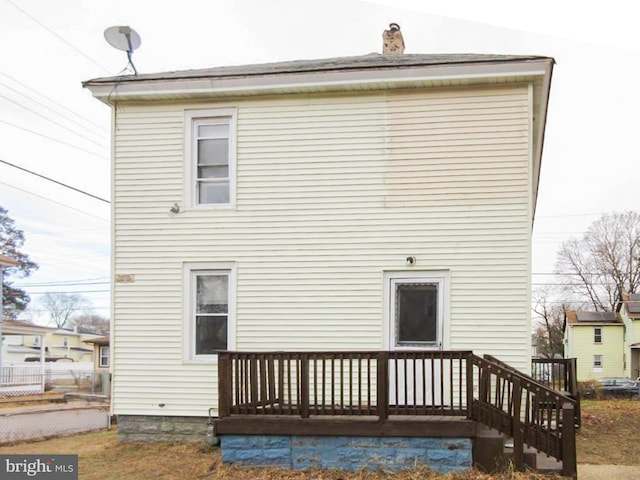 back of house featuring a deck