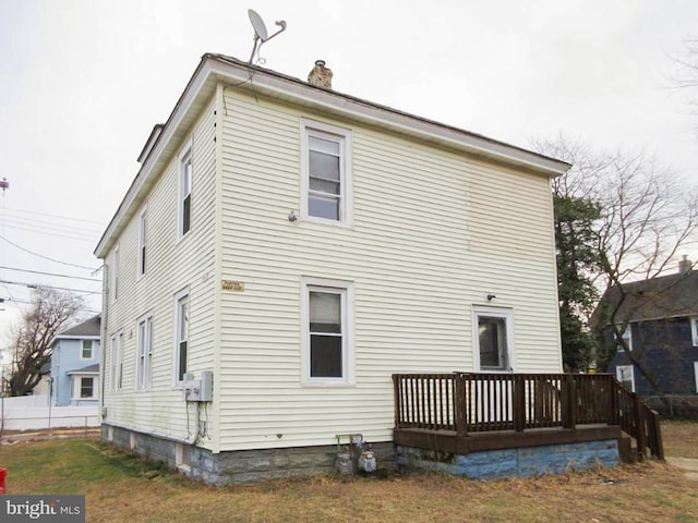 rear view of house with a wooden deck