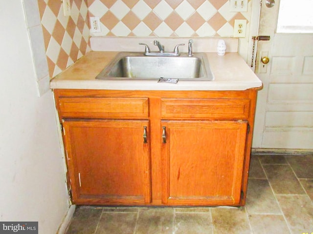 kitchen with tasteful backsplash and sink