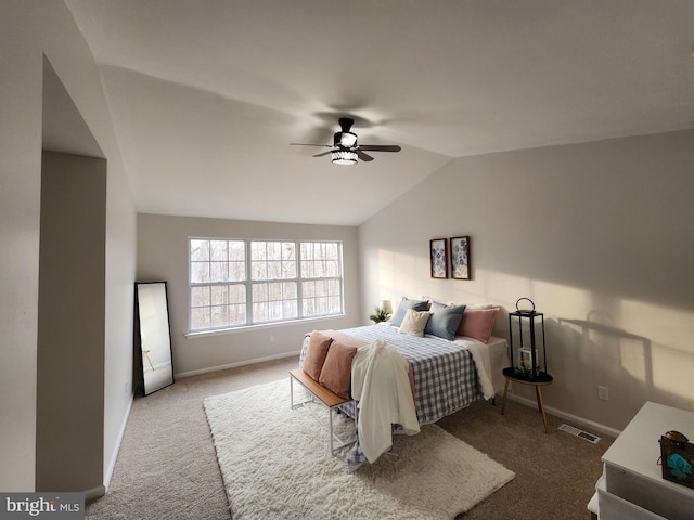 bedroom with vaulted ceiling, carpet floors, and ceiling fan