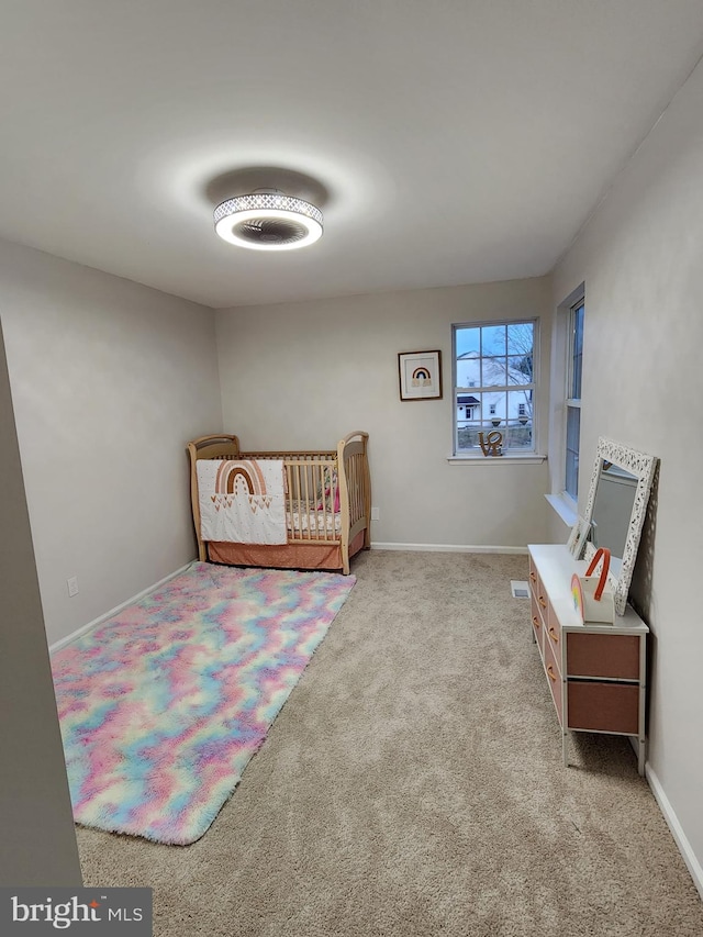 bedroom with light colored carpet