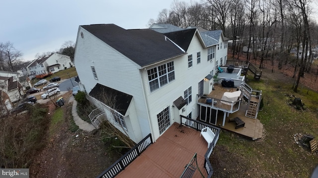 view of home's exterior featuring a wooden deck