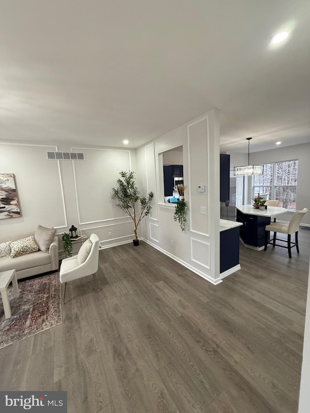 living room featuring dark hardwood / wood-style floors