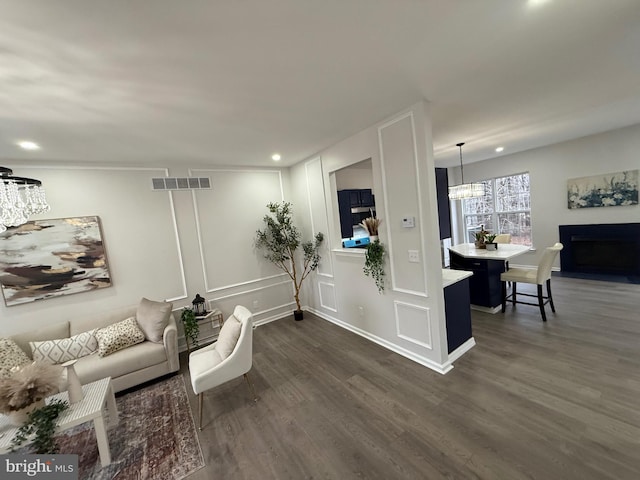 living room featuring dark wood-type flooring