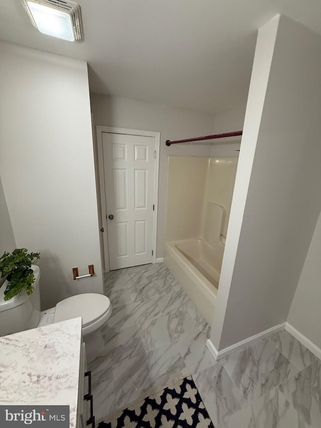 bathroom with walk in shower, vanity, and toilet