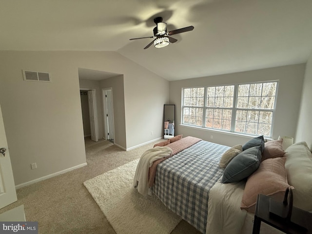 carpeted bedroom with ceiling fan and lofted ceiling