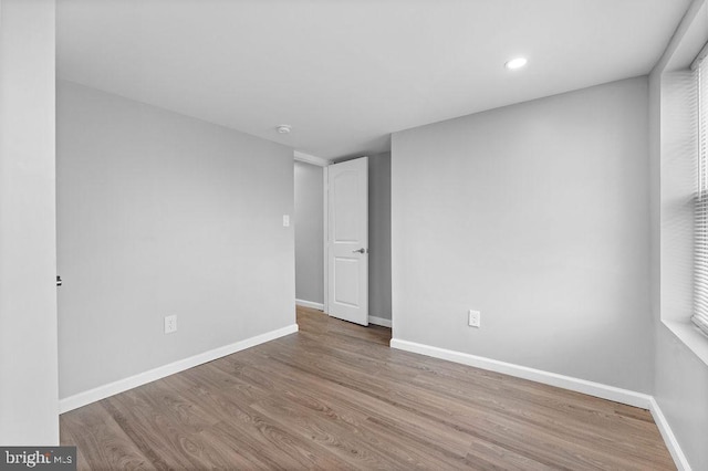 spare room with light hardwood / wood-style floors