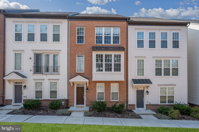 multi unit property featuring brick siding