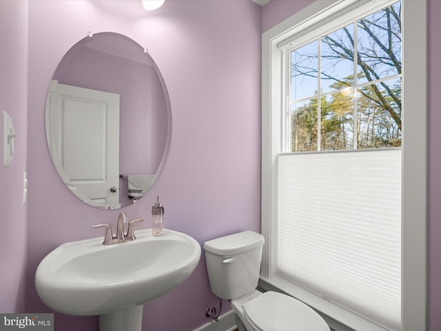 bathroom with toilet and a sink