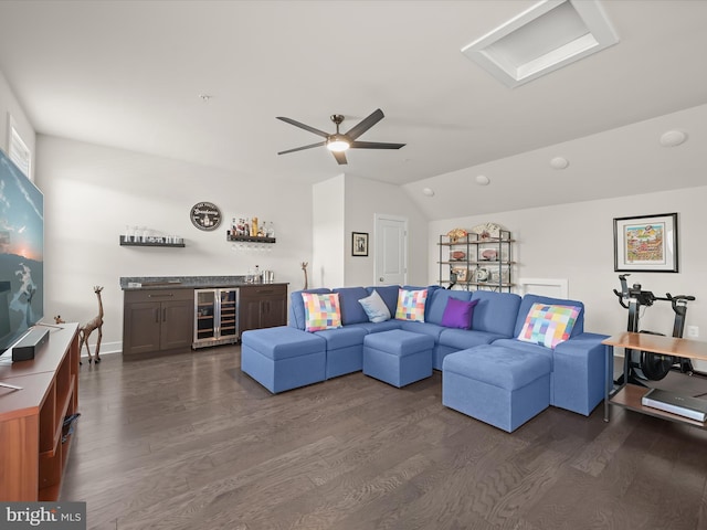 living area with a bar, lofted ceiling, wine cooler, and dark wood finished floors