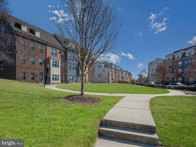 view of community with a lawn and a residential view