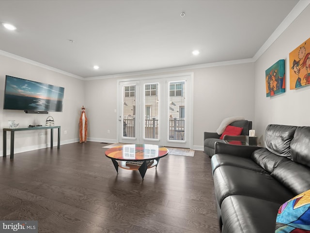 living room featuring crown molding, wood finished floors, and baseboards