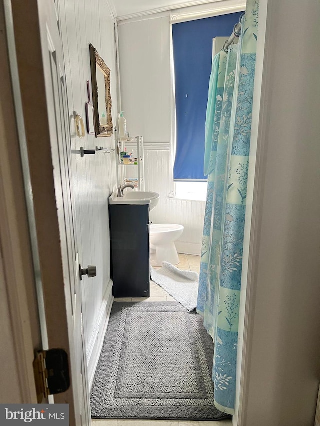 bathroom with vanity, tile patterned flooring, and toilet