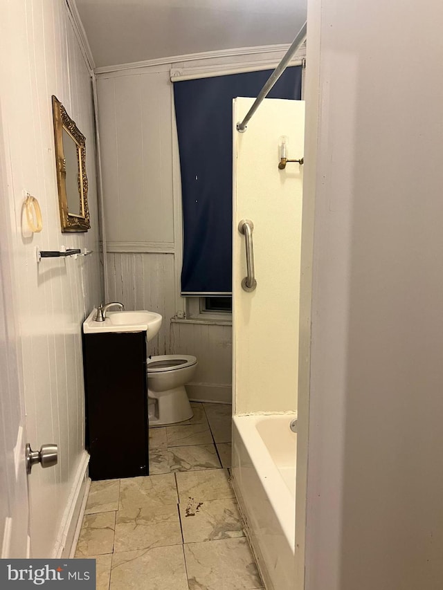 bathroom with vanity, ornamental molding, and toilet