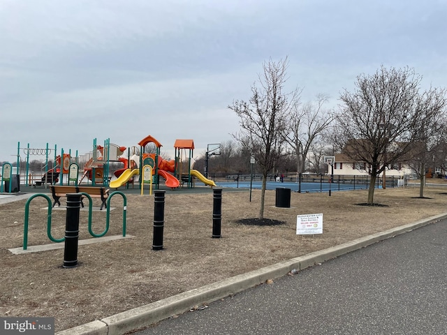 communal playground featuring fence