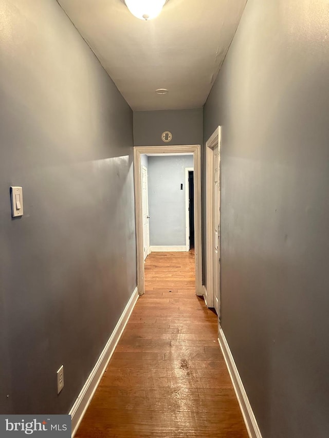 hallway with light wood-type flooring