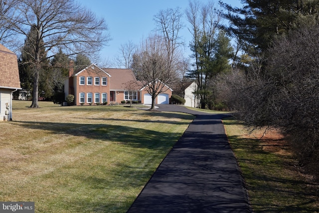 view of road with aphalt driveway