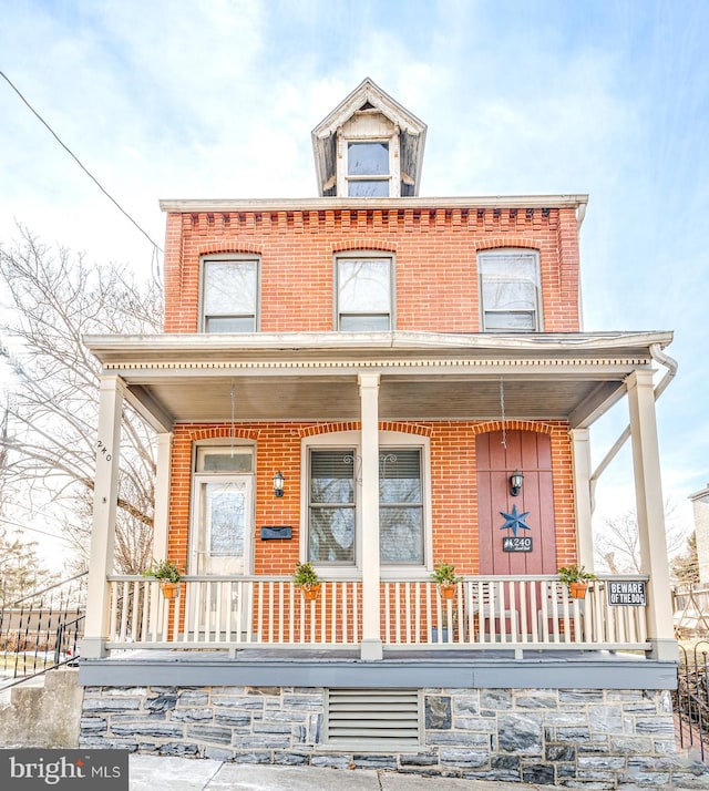 view of front of home featuring covered porch