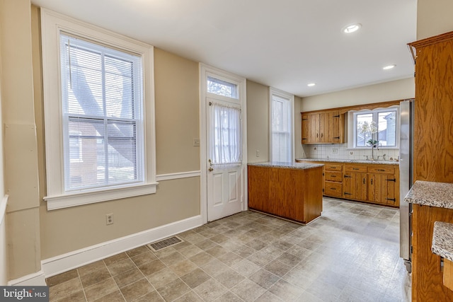 kitchen with tasteful backsplash and sink