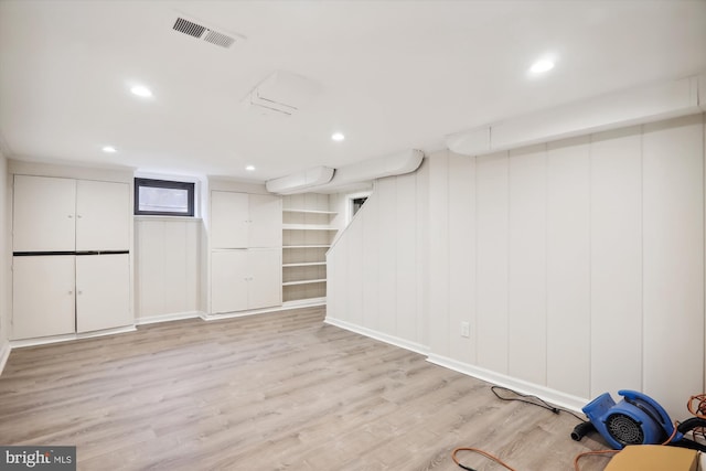 basement featuring light wood-type flooring