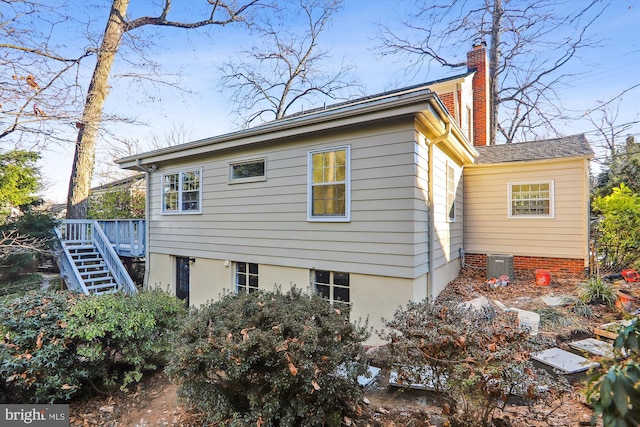 view of side of property with a deck