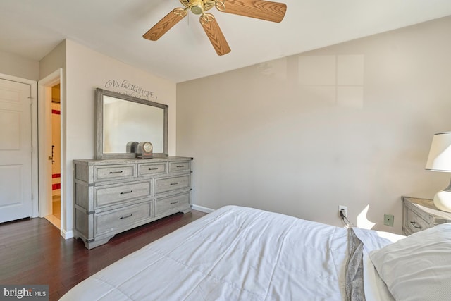 bedroom featuring ceiling fan, dark wood-style flooring, and baseboards